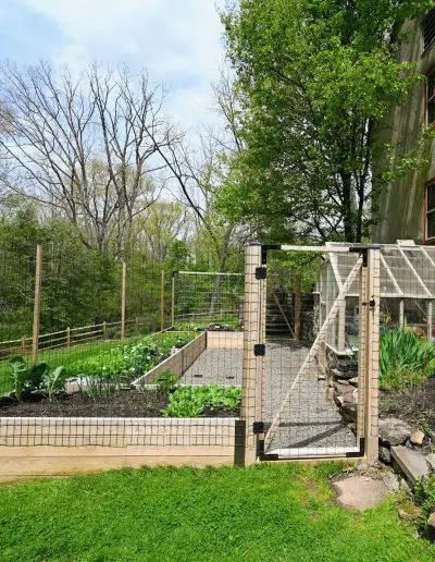 raised bed garden next to house on slope