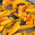 Photo of cut butternut squash on a baking sheet from Sara Dubler from Unsplash