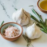 Photo of garlic bulbs and salt from Jess Loiterton from Pexels