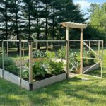 G-shaped raised bed garden in a sloped landscape