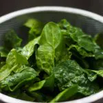 Photo of greens in a colander from Chiara Conti from Unsplash