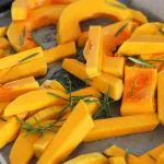 Photo of cut butternut squash on a baking sheet from Sara Dubler from Unsplash