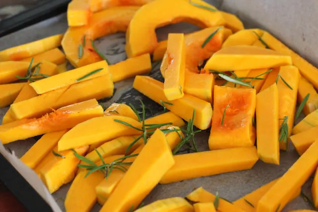 Photo of cut butternut squash on a baking sheet from Sara Dubler from Unsplash